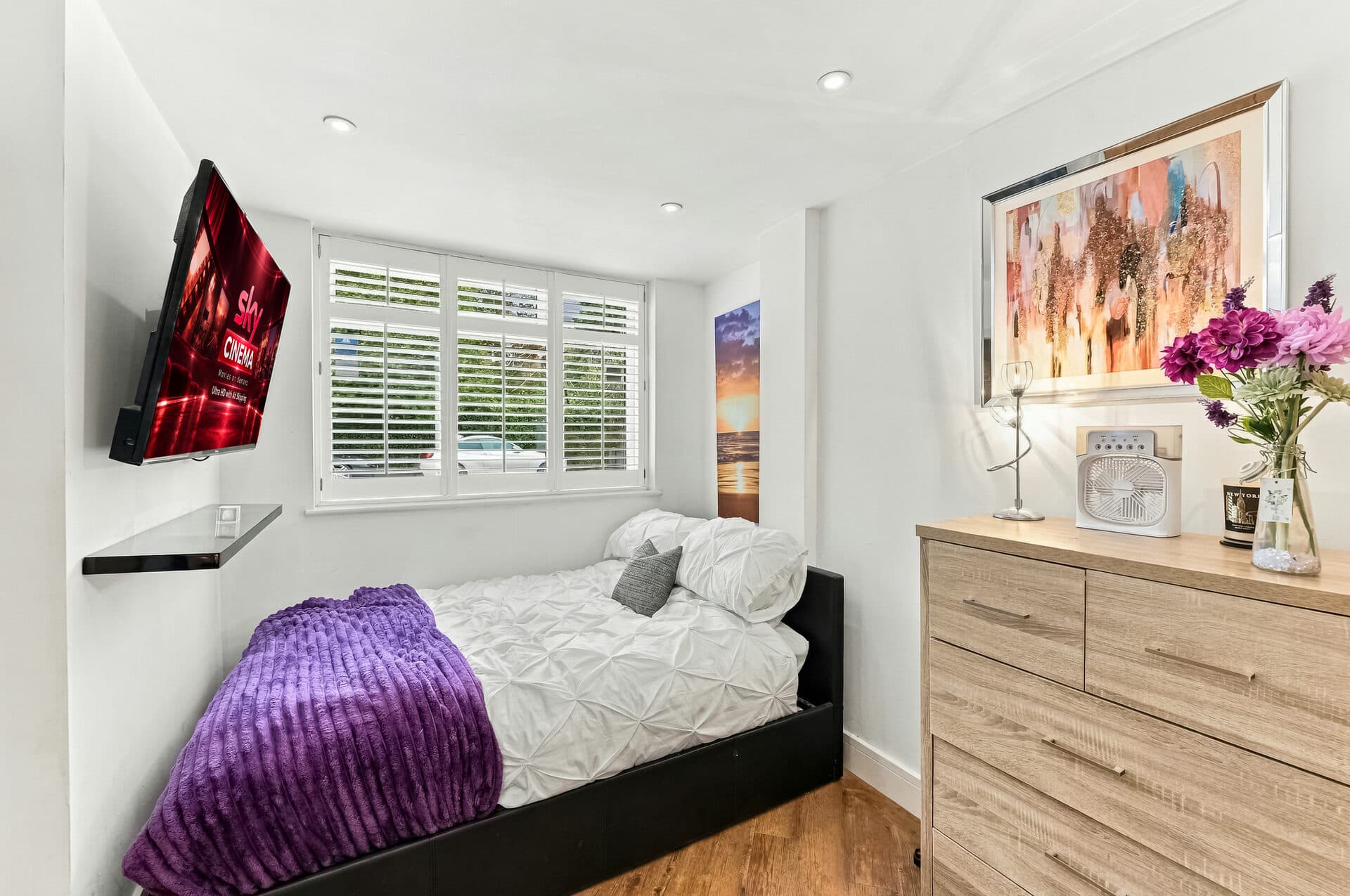 Second double bedroom with wall-mounted smart TV
