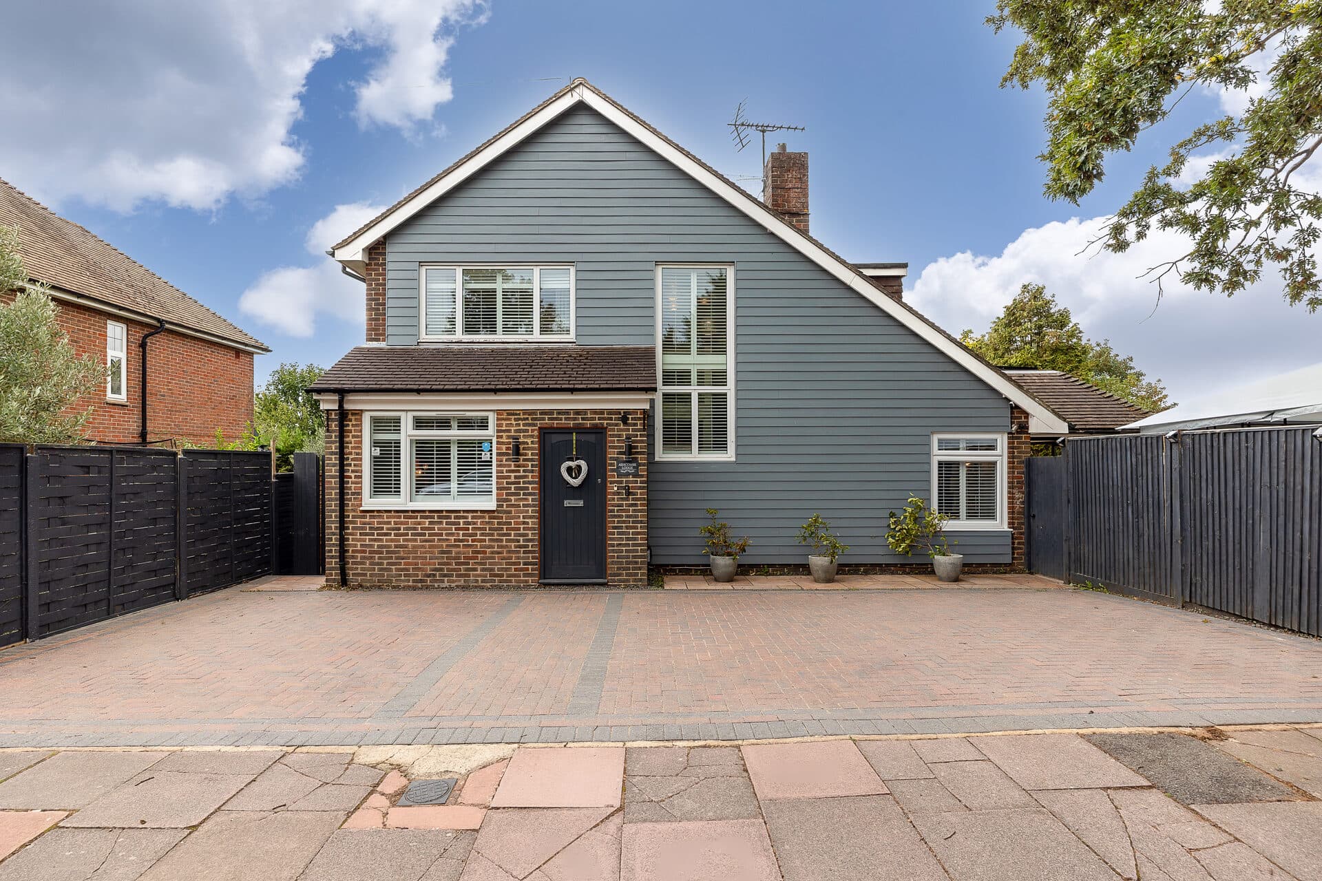 Front exterior and private driveway at Ashcombe Lodge