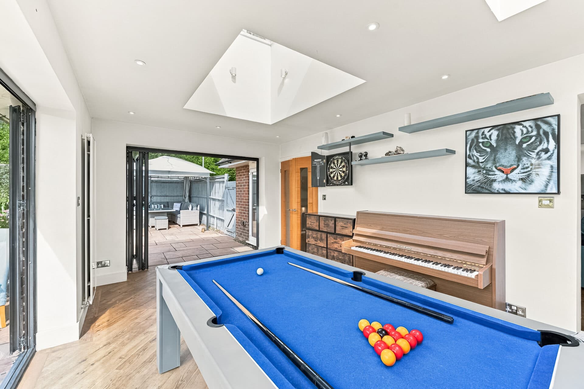 Games room with pool table, dartboard and piano